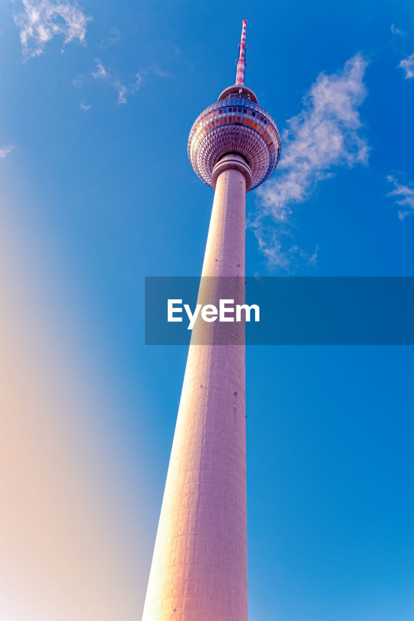 Low angle view of communications tower against sky