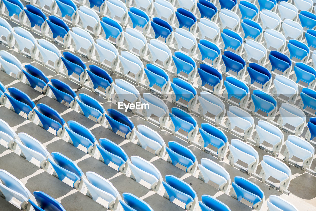 Empty seats in a football stadium in sunlight