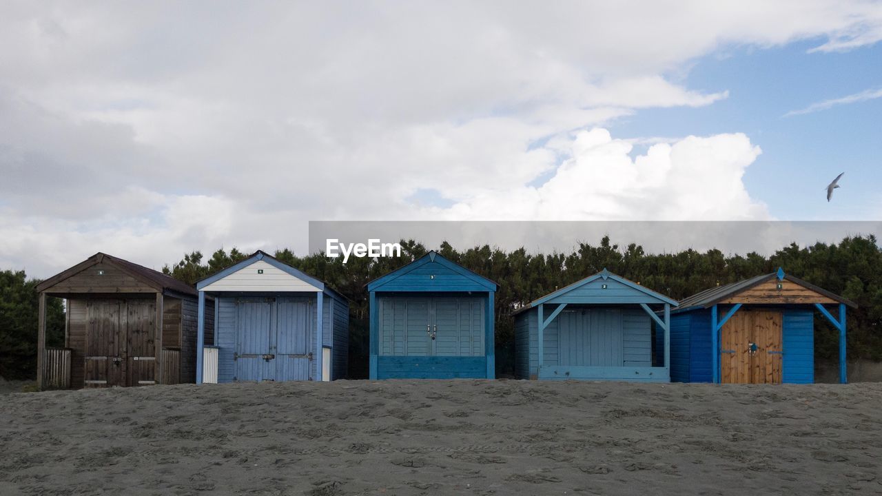 Built structure on beach against sky