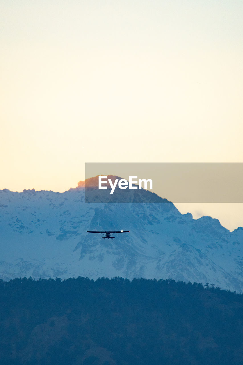 SCENIC VIEW OF MOUNTAINS AGAINST SKY DURING WINTER