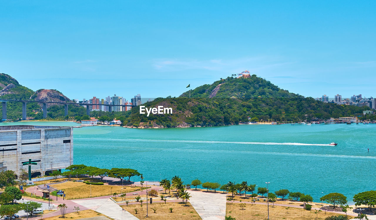 Scenic view of bay against blue sky