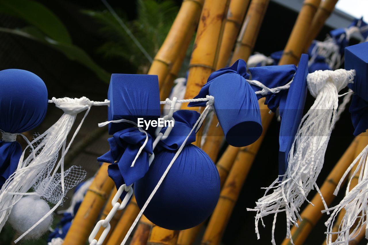 Close-up of textile art hanging on clothesline