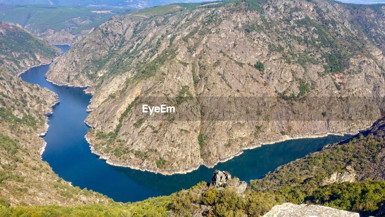 High angle view of lake amidst mountains