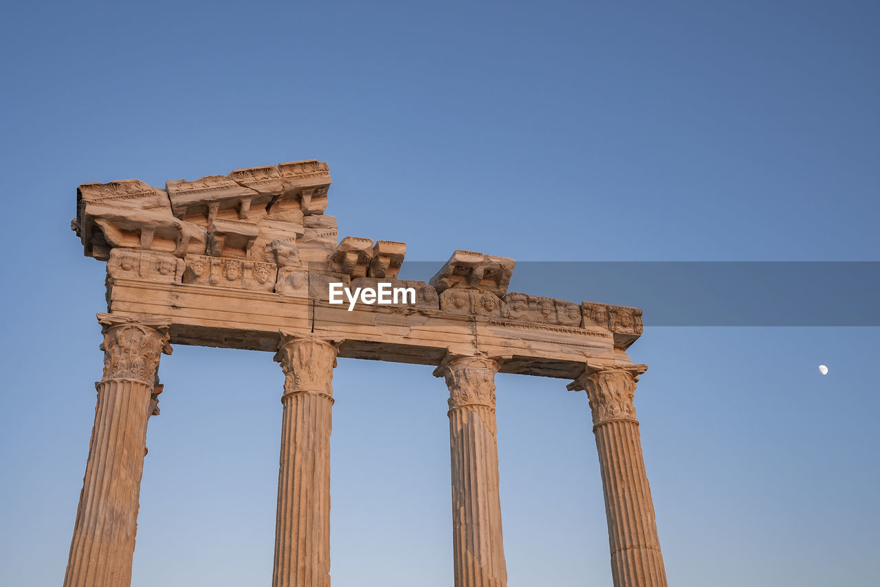 Roman temple of apollo under clear sky at dusk in side, turkey