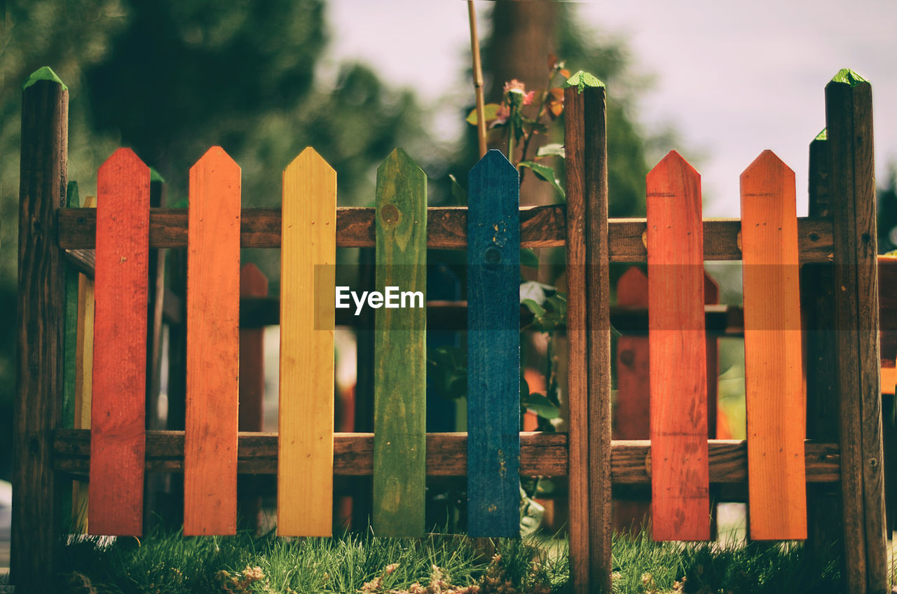 Colorful wooden fence at park