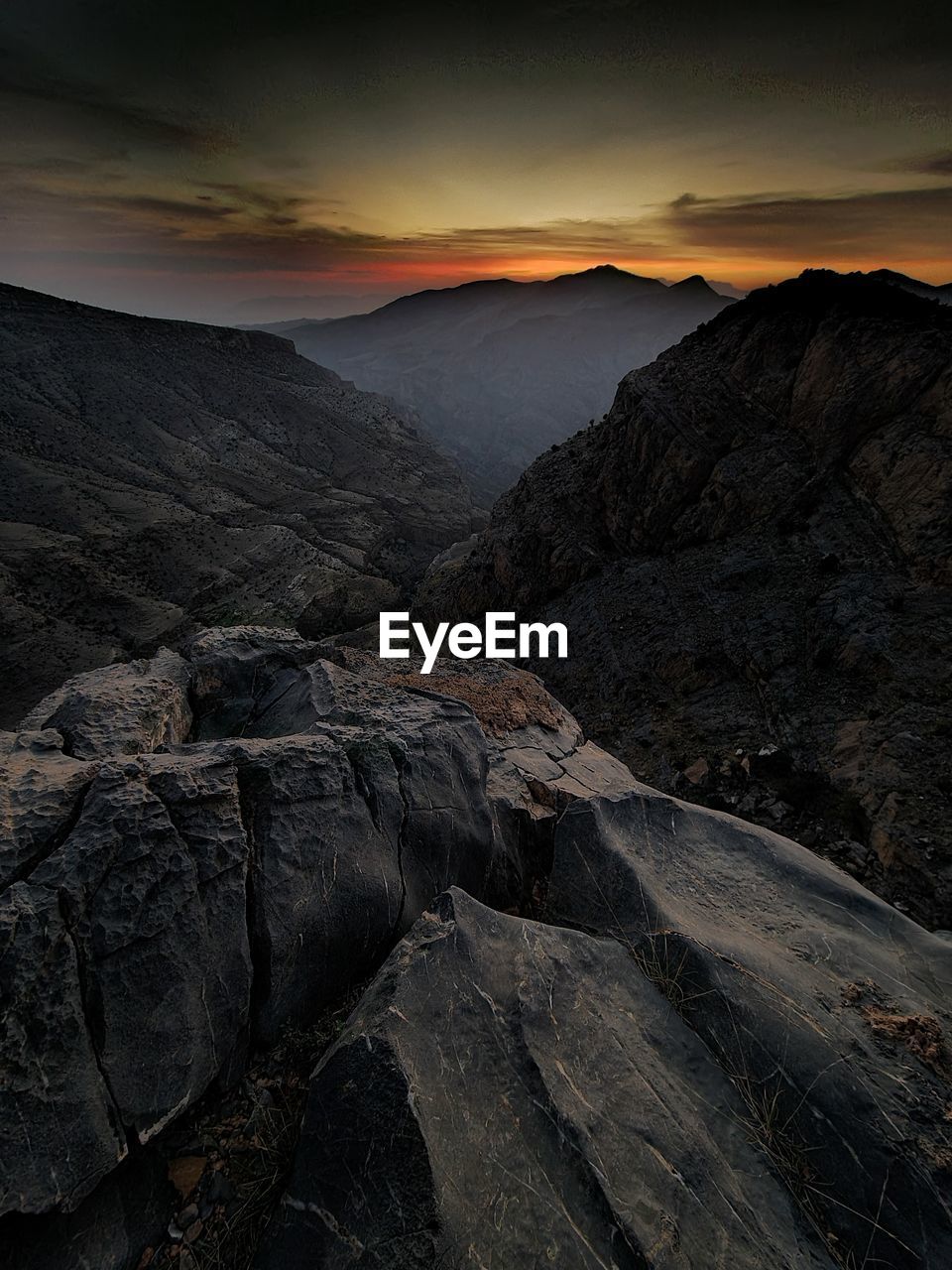 Scenic view of mountains against sky during sunset