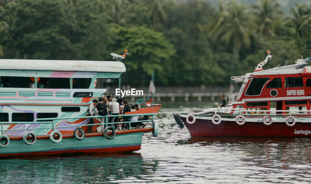 water, transportation, nautical vessel, mode of transportation, boat, vehicle, ship, nature, watercraft, sea, boating, ferry, travel, waterfront, day, motor ship, tree, craft, outdoors, tugboat, waterway, tourism, passenger ship, group of people, travel destinations
