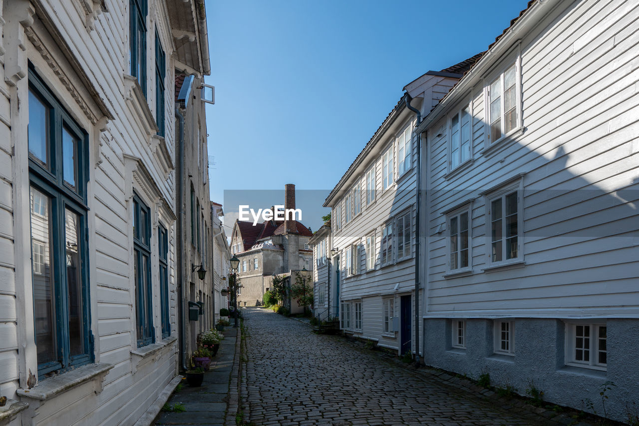 Street amidst buildings against sky