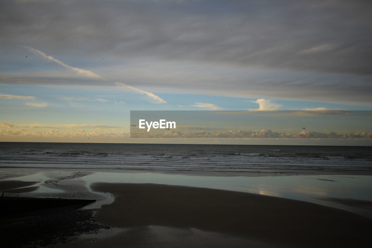 SCENIC VIEW OF SEA DURING SUNSET