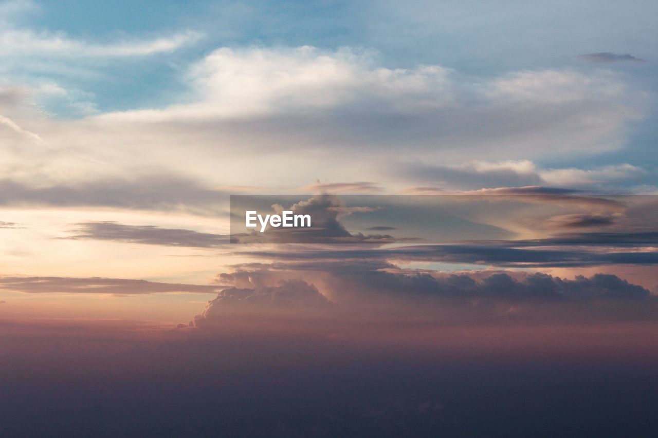 Scenic view of cloudy sky at sunset