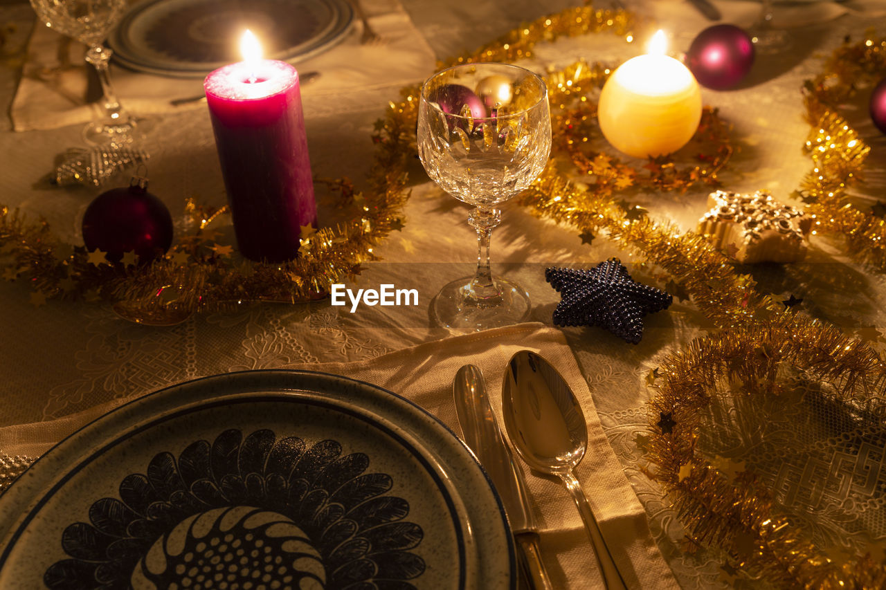 High angle view of illuminated christmas decorations on dining table