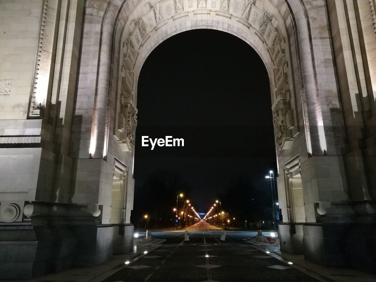 ILLUMINATED ROAD AT NIGHT