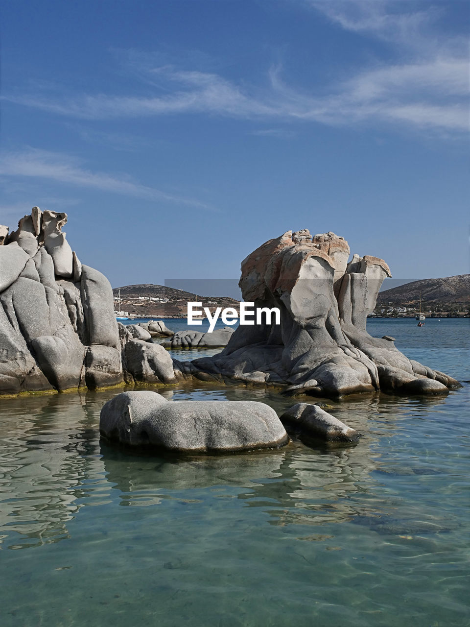 ROCK FORMATIONS BY SEA AGAINST SKY