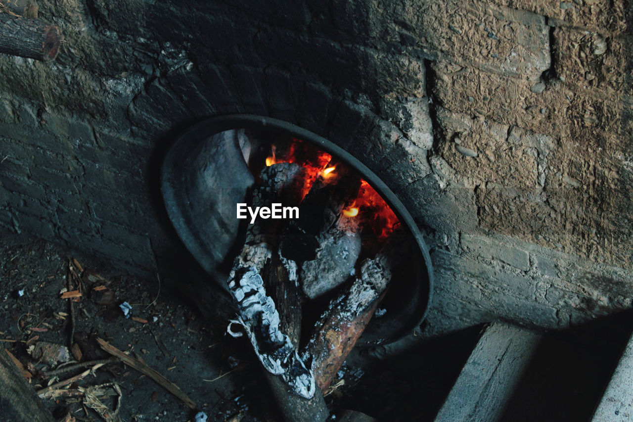 High angle view of fire on wood