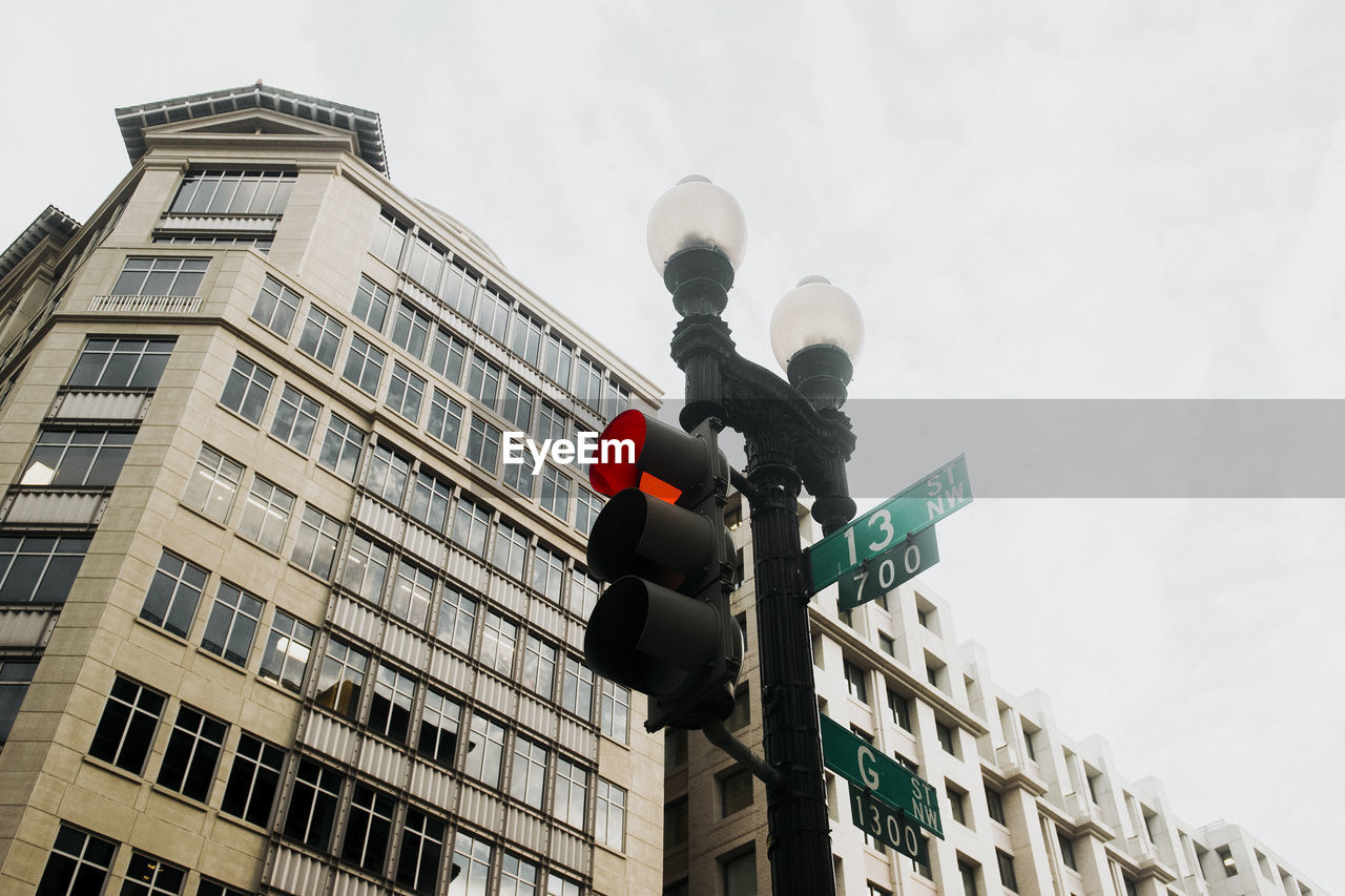 LOW ANGLE VIEW OF BUILDINGS AGAINST SKY