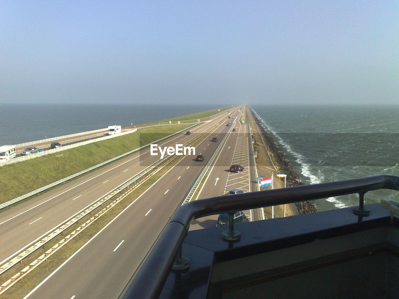 Road leading towards sea against sky