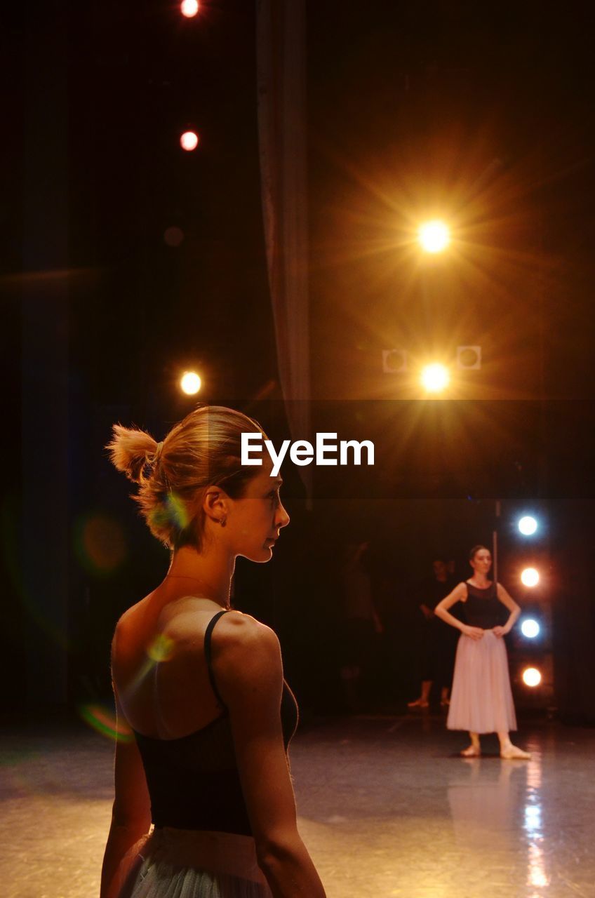 Women practicing ballet on stage