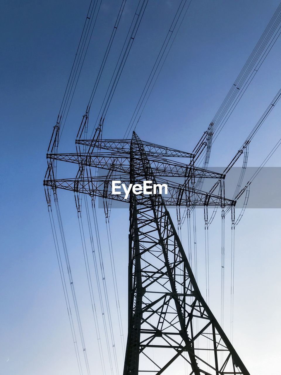 Low angle view of power line against clear sky