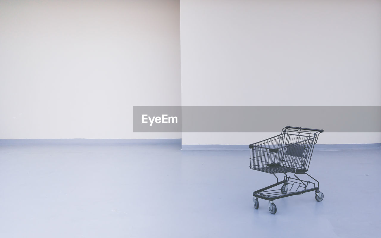 Empty shopping cart in room