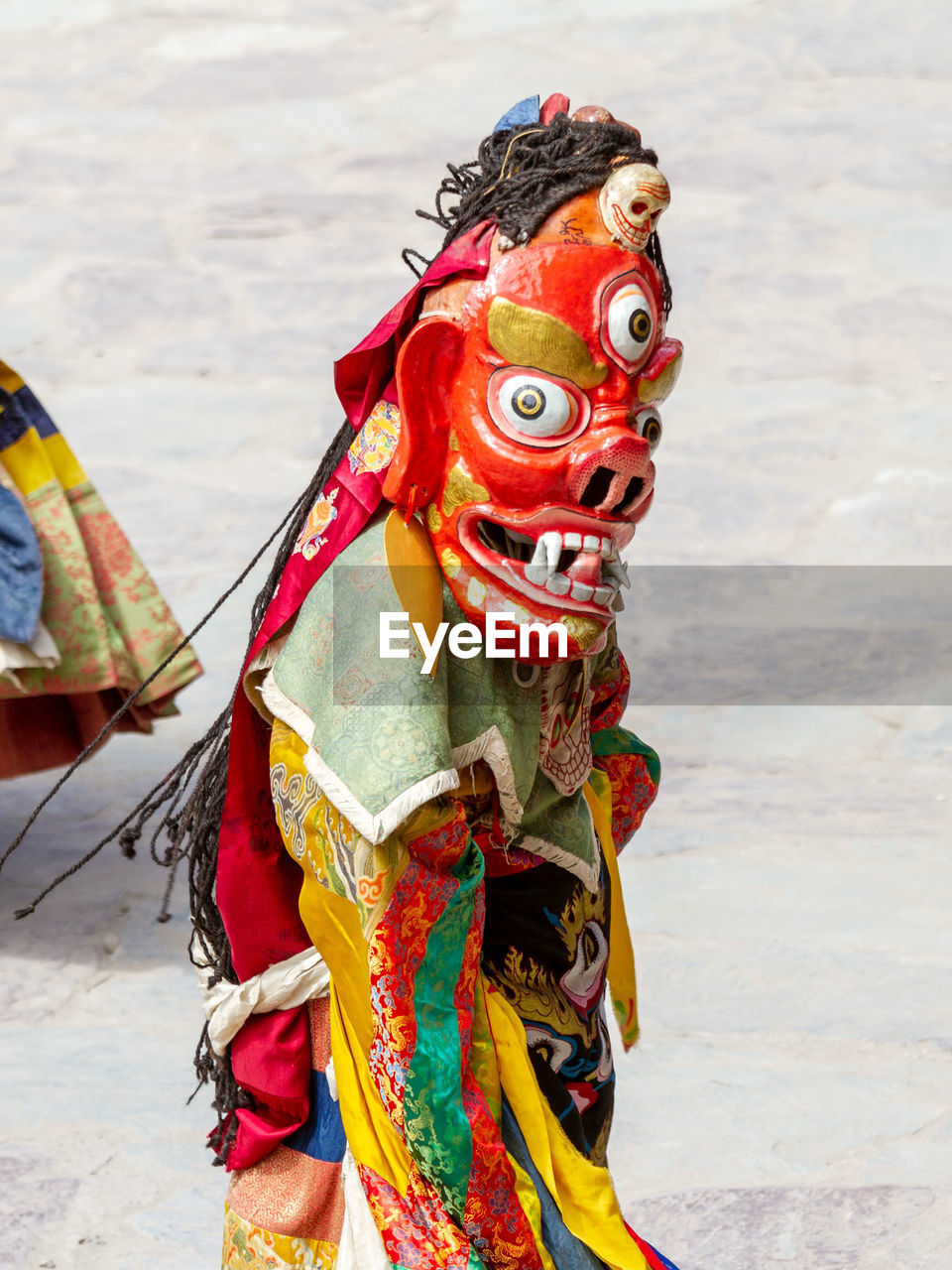 CLOSE-UP OF MULTI COLORED STATUE ON STREET