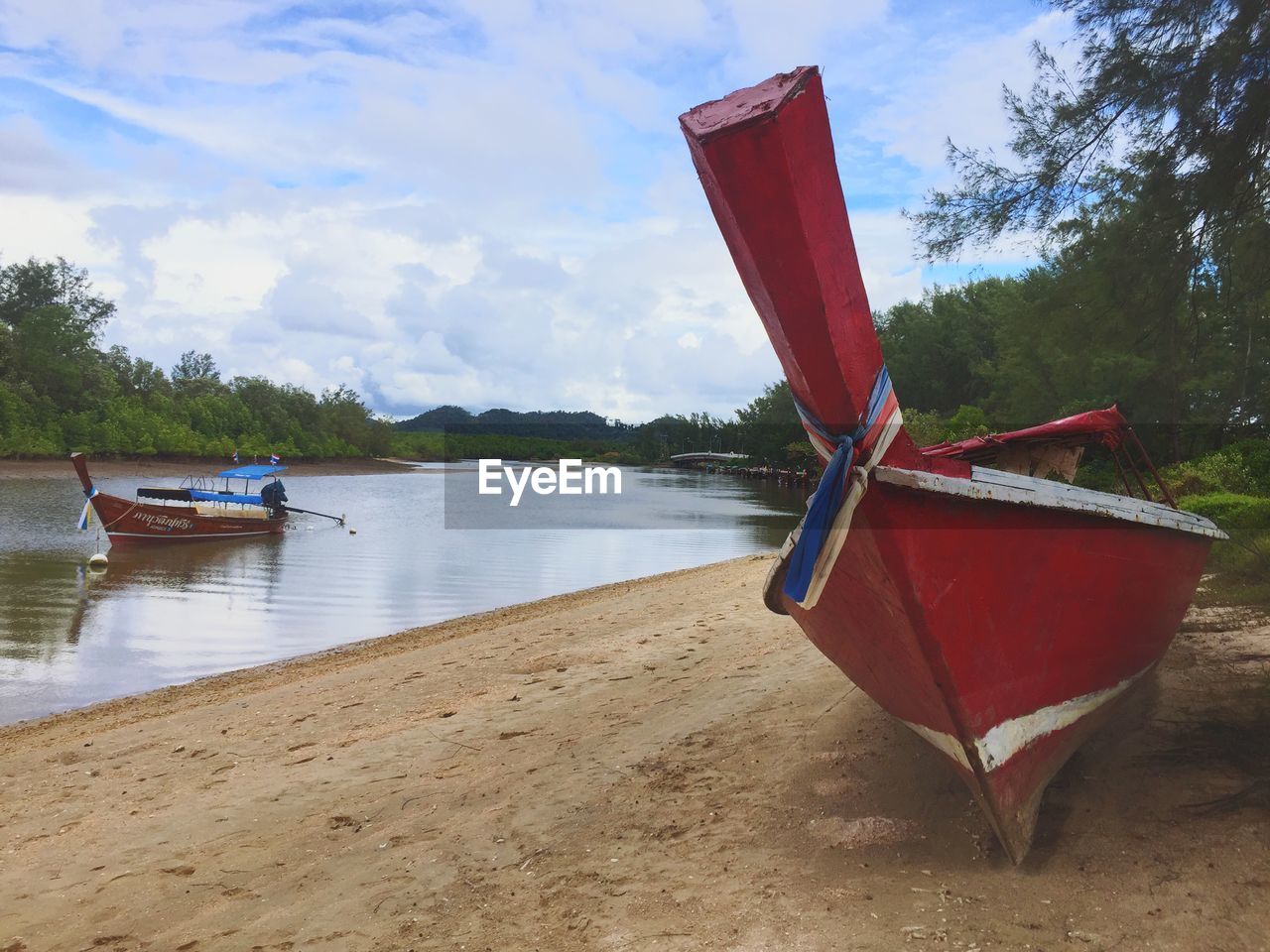 BOAT ON LAKE AGAINST SKY