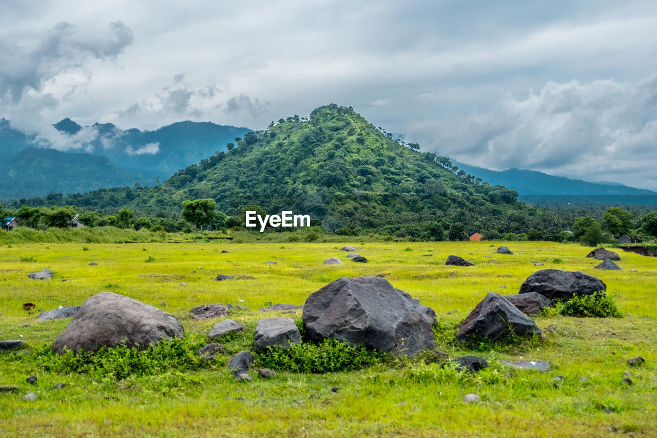 SCENIC VIEW OF ROCKS AGAINST SKY