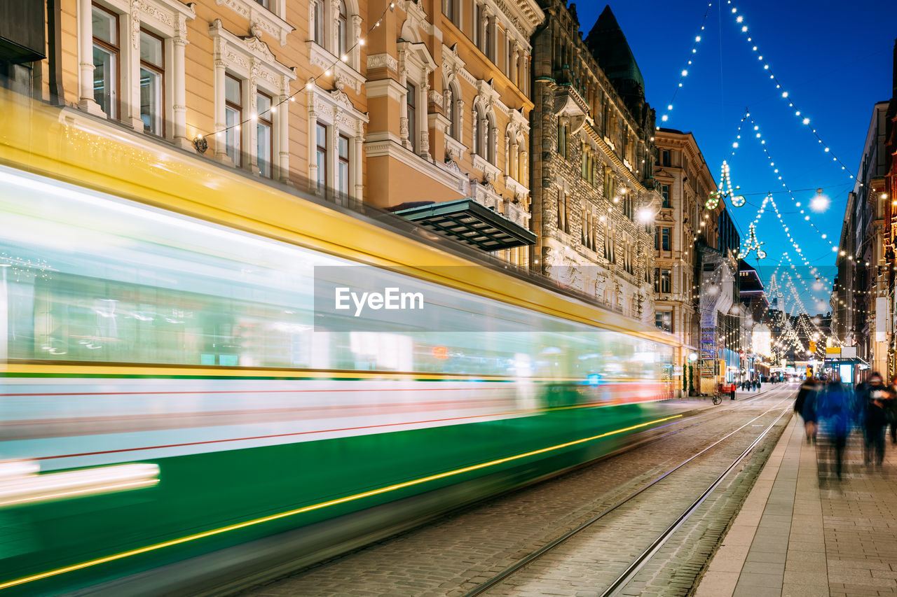 Blurred motion of cable car on street