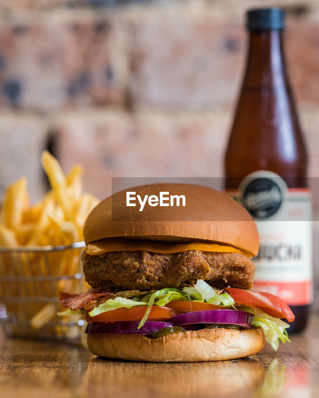 CLOSE-UP OF BURGER IN CONTAINER ON TABLE