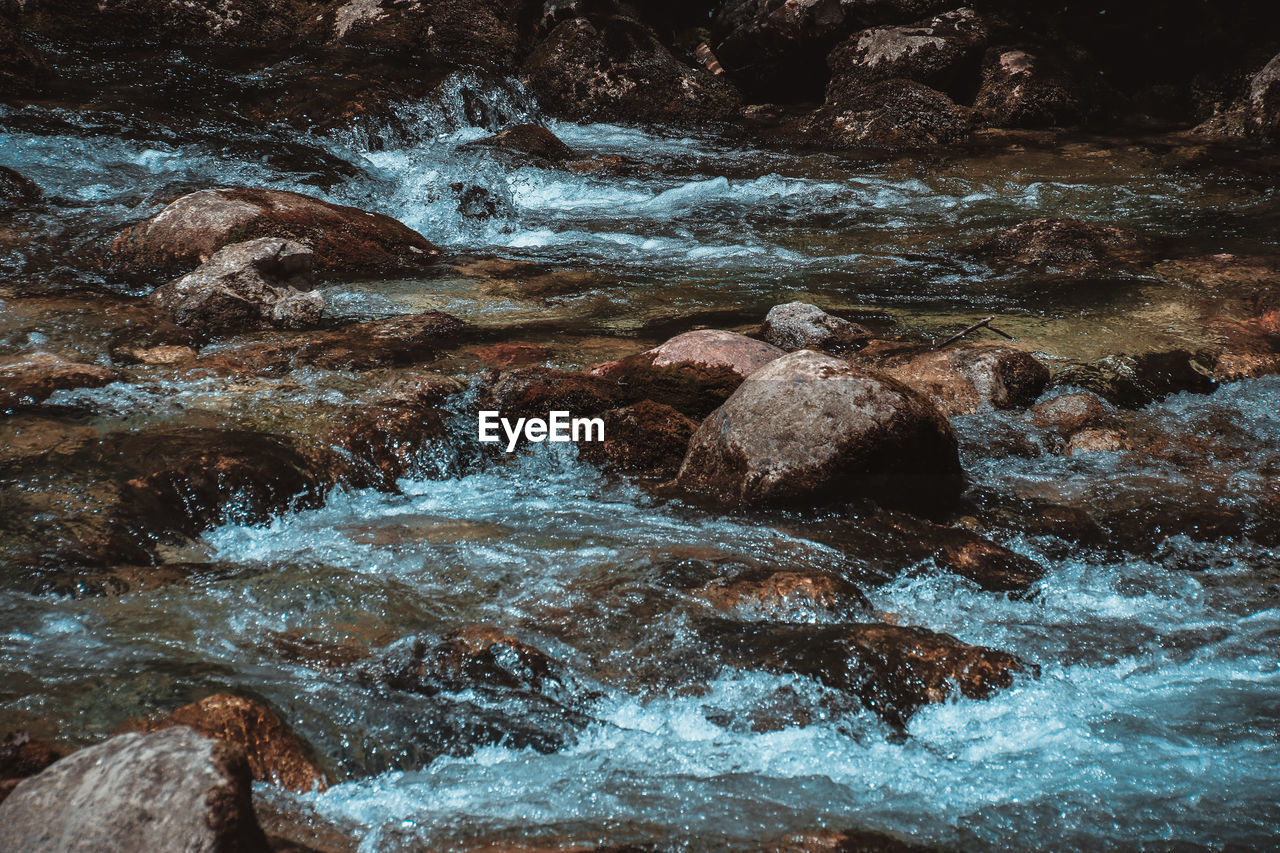 Close-up of water flowing through rocks