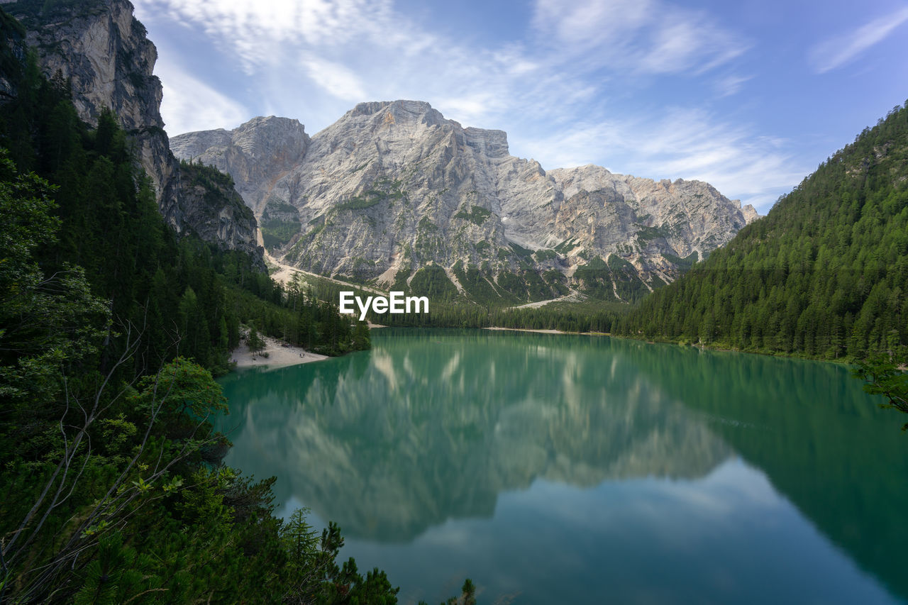 Scenic view of lake and mountains against sky