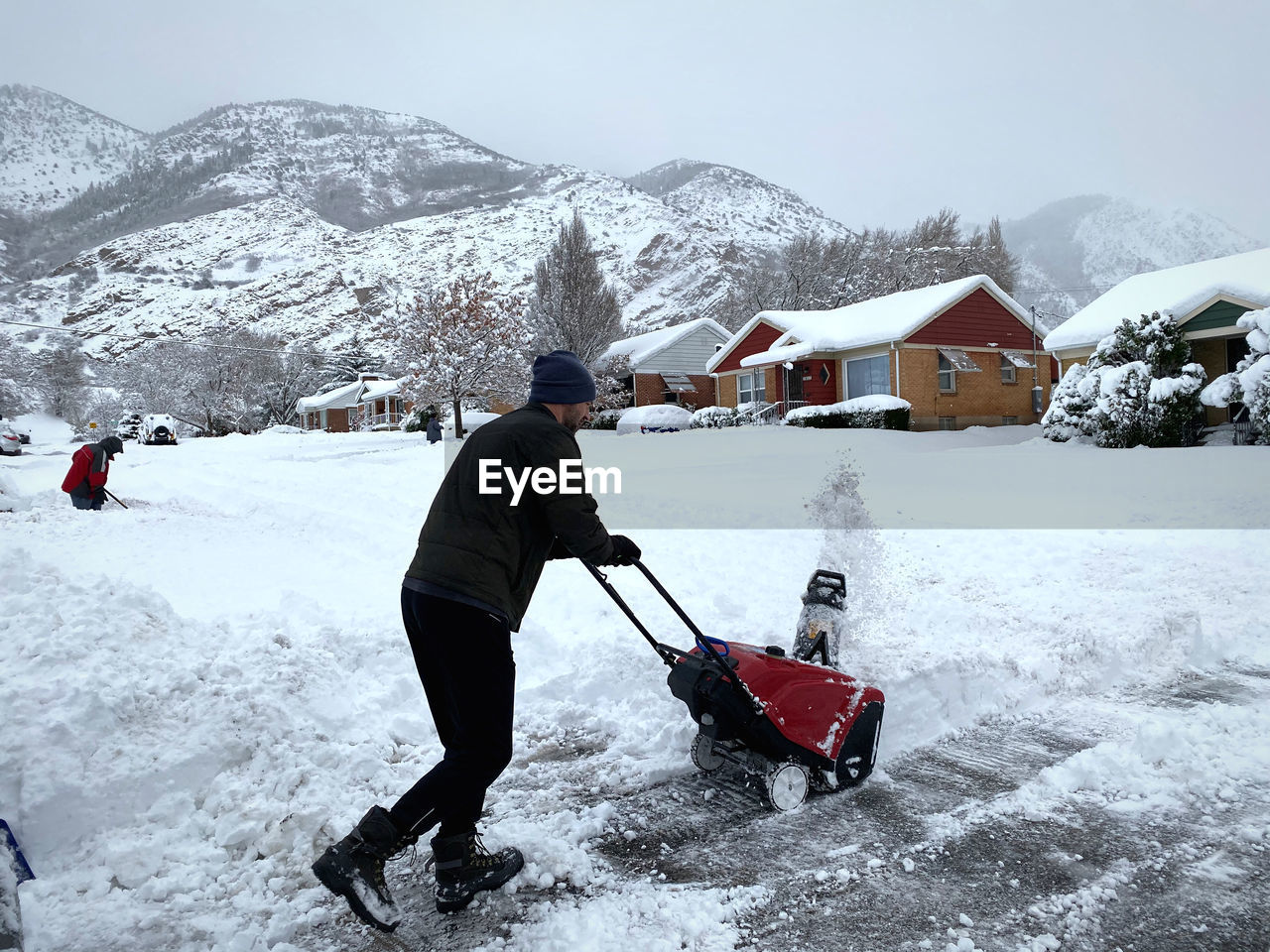 Rear view of snowblower at work