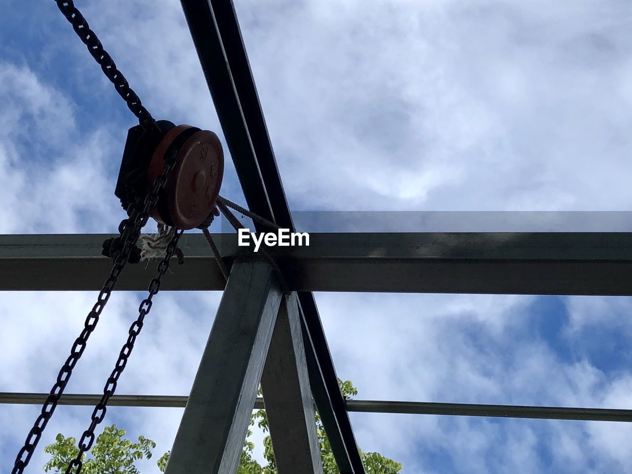 LOW ANGLE VIEW OF CHAIN AGAINST CLOUDY SKY