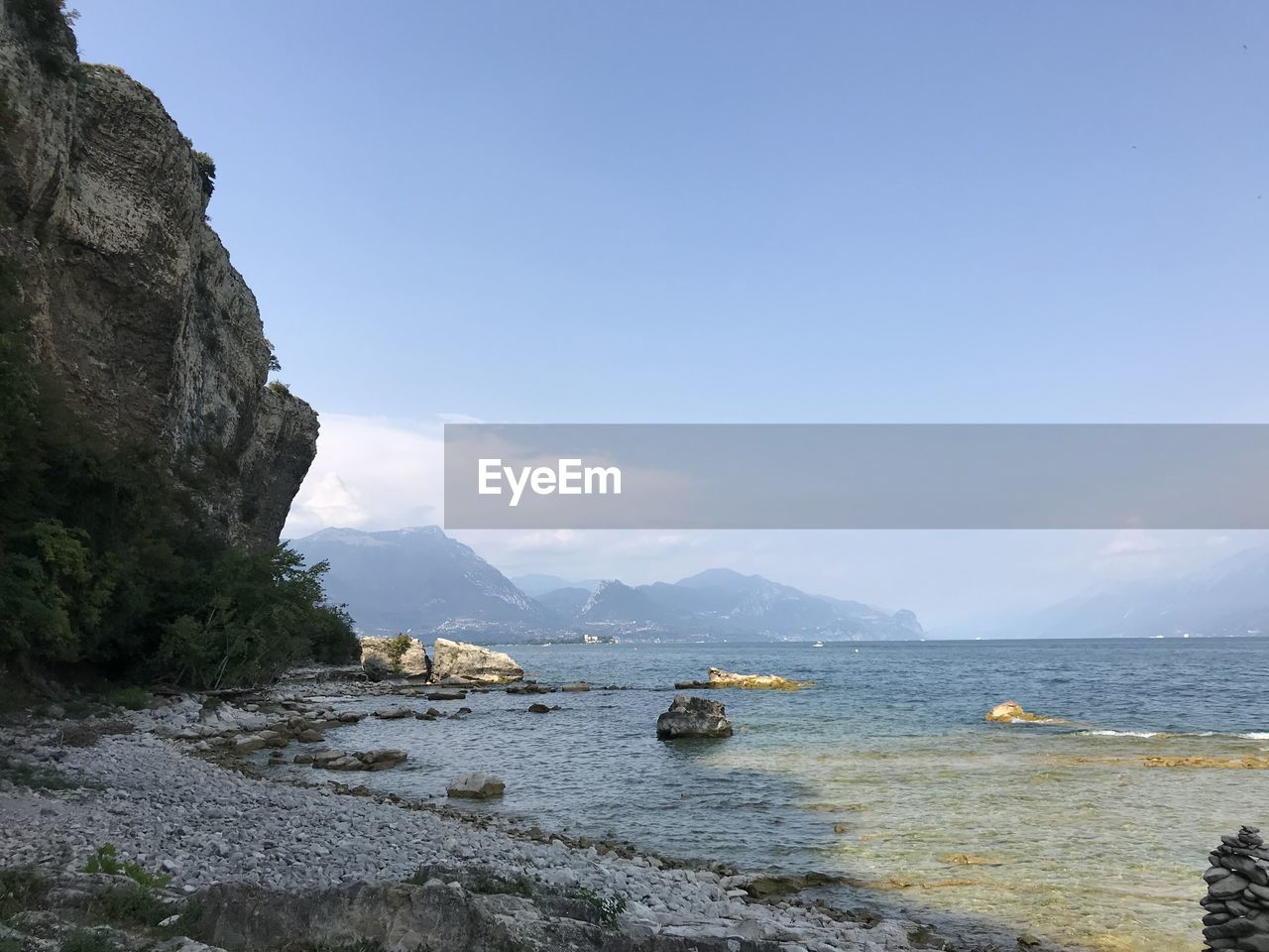 scenic view of sea against clear blue sky