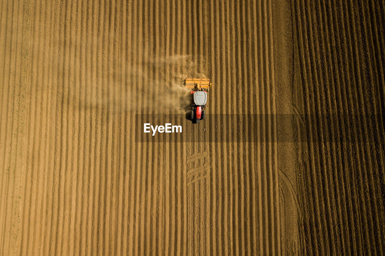 Aerial view of tractor moving on field