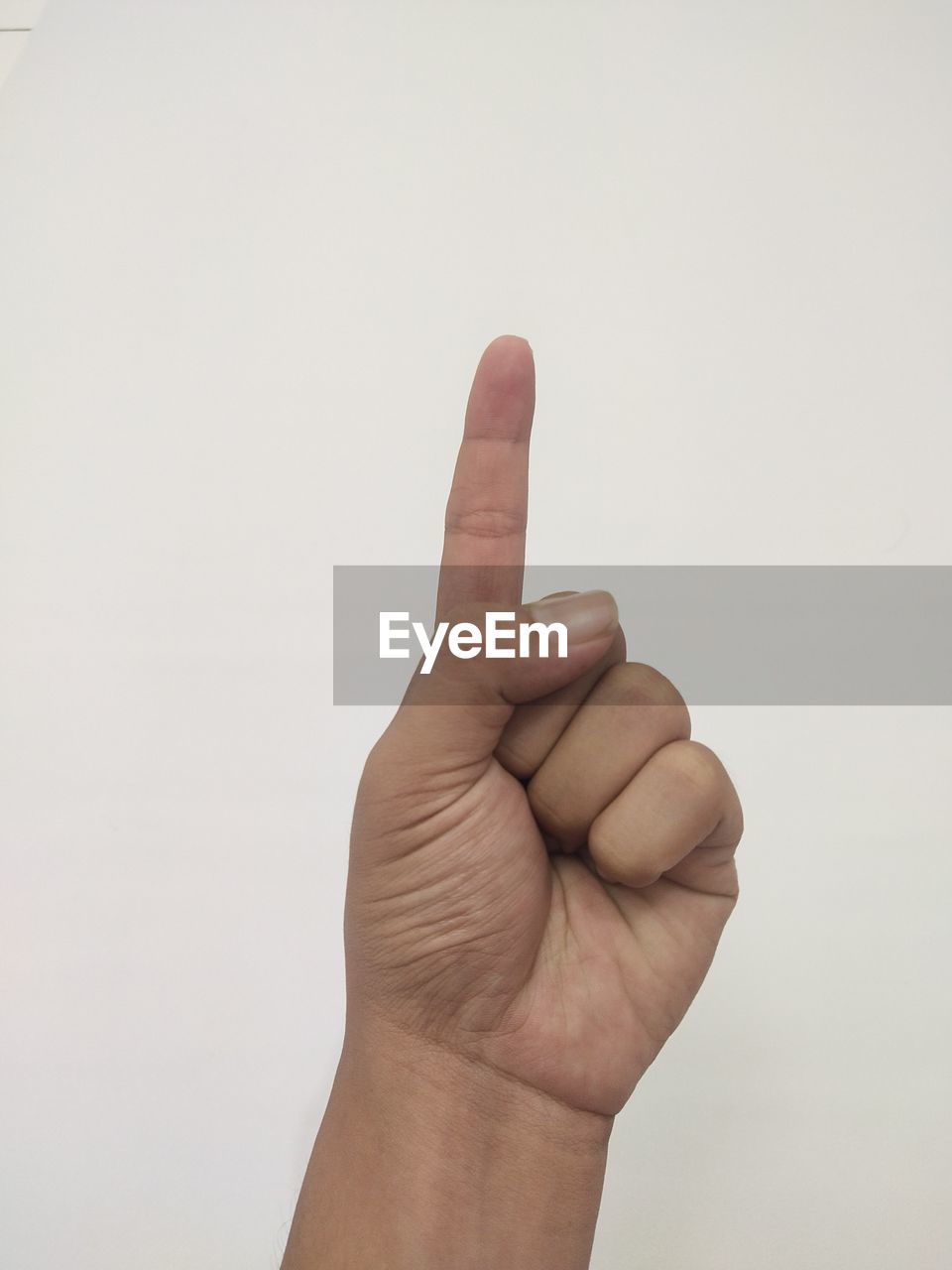 Cropped hand gesturing against white background