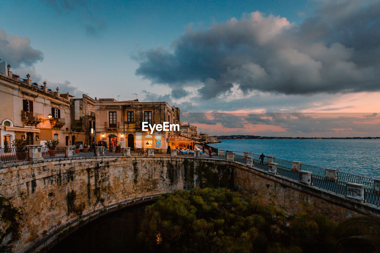 Panoramic view of ortigia with fonte aretusa and lungomare alfeo  during sunset