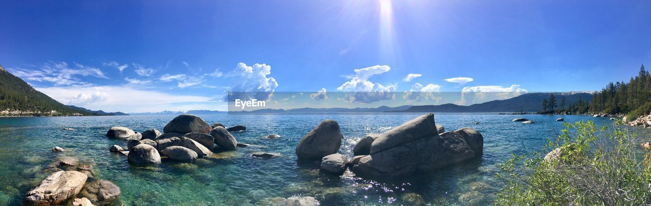 Panoramic view of sea against blue sky