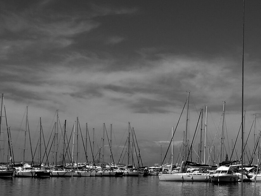 BOATS MOORED IN SEA