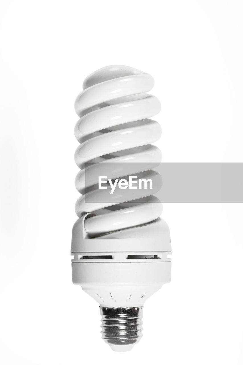 light bulb, electricity, light fixture, lamp, incandescent light bulb, lighting, cut out, white background, lighting equipment, light, indoors, energy efficient, energy efficient lightbulb, single object, studio shot, no people, power generation, white, technology, spiral, environmental conservation, metal, copy space, close-up