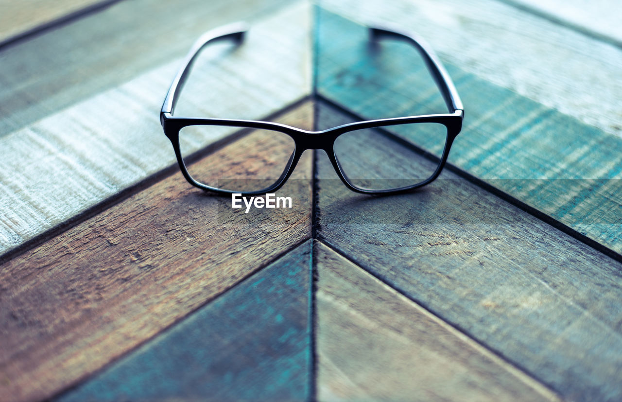 High angle view of eyeglasses on wooden table