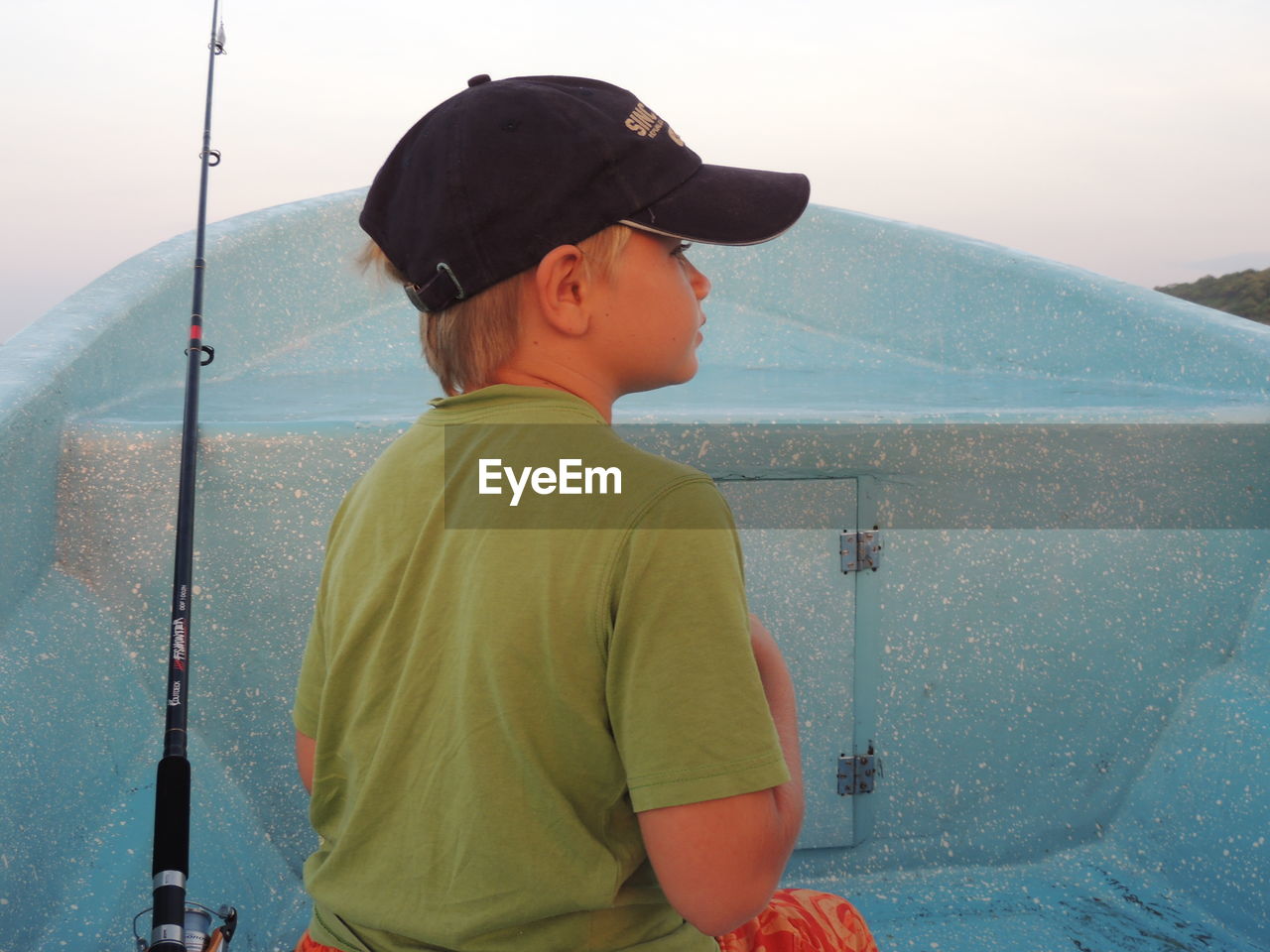 REAR VIEW OF BOY LOOKING AT VIEW