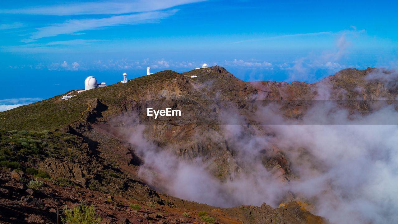 SMOKE EMITTING FROM VOLCANIC LANDSCAPE