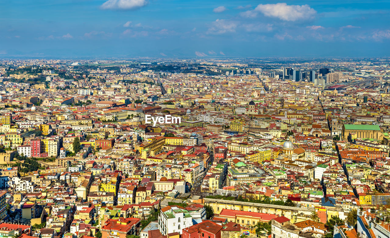 HIGH ANGLE VIEW OF CITY AGAINST SKY