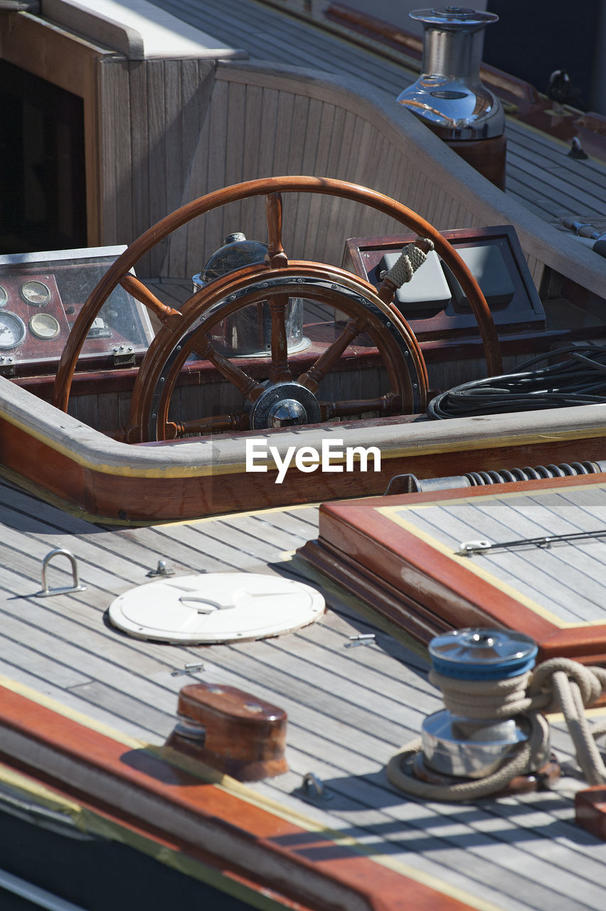 Close-up of helm on ship during summer