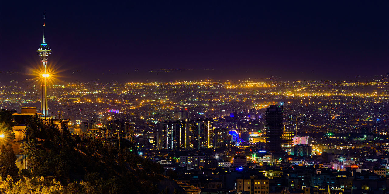 Illuminated buildings in city at night