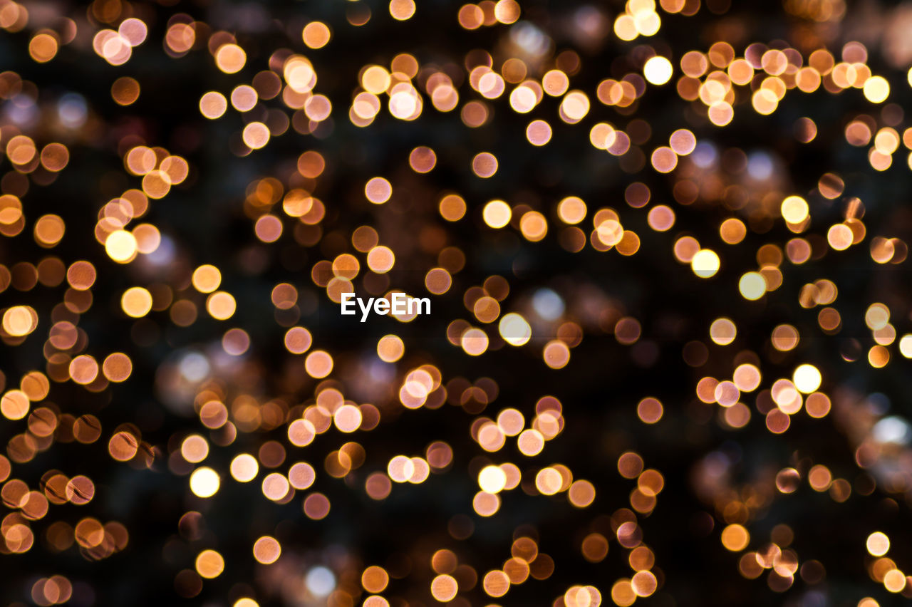 Defocused image of illuminated lights at night