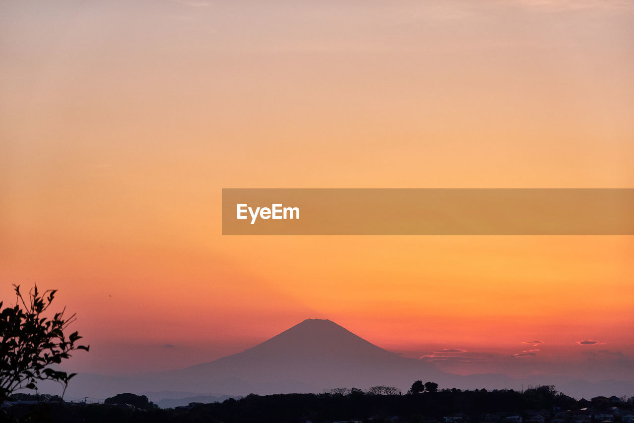 Scenic view of silhouette landscape against romantic sky at sunset