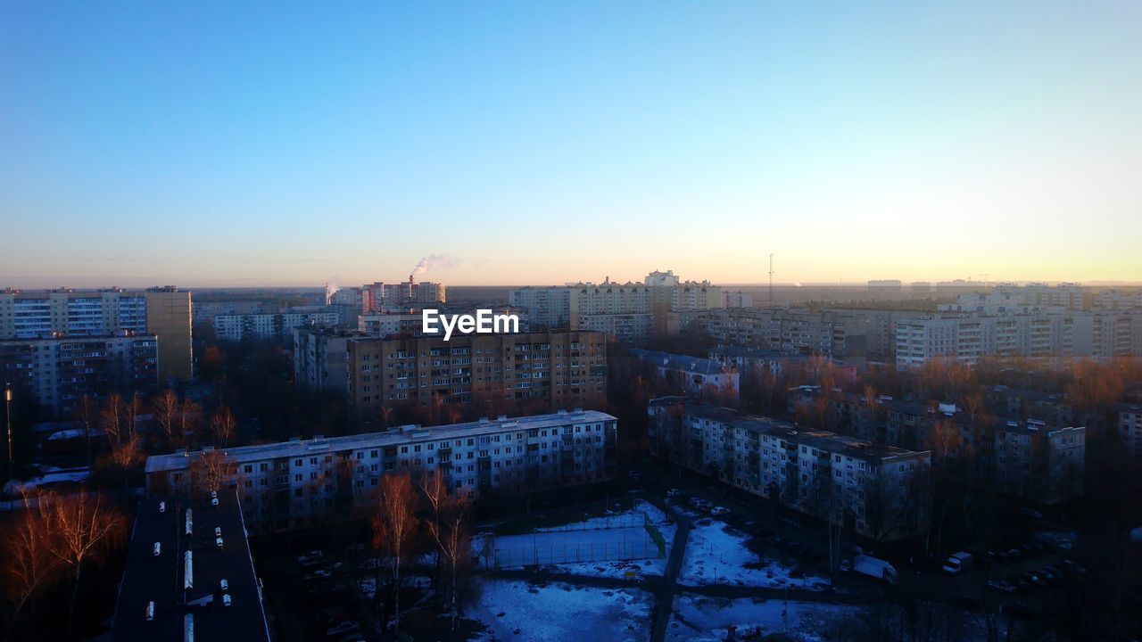 High angle view of buildings against sky during winter