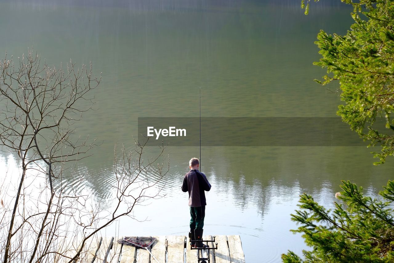 Man standing on lakeshore