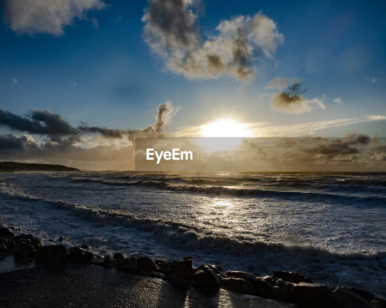 SCENIC VIEW OF BEACH DURING SUNSET